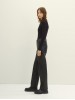 Чорні штани з екошкіри для жінок від бренду Tom Tailor