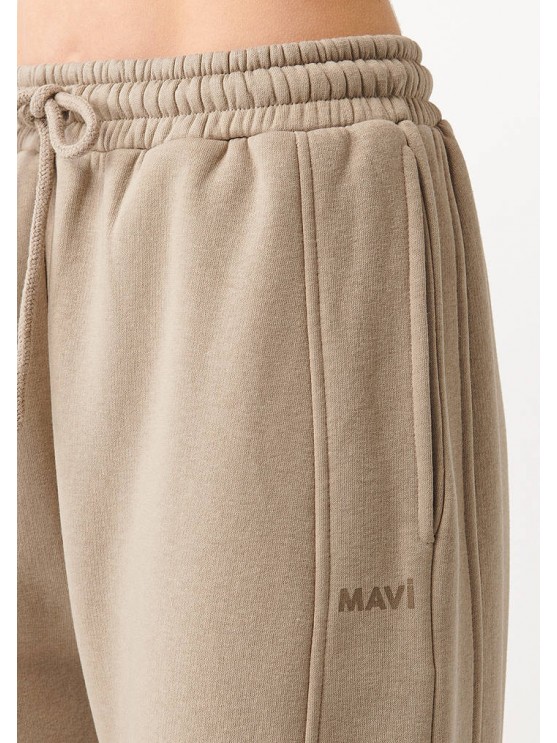 Stay comfortable and stylish with Mavi's beige sporty trousers for women
